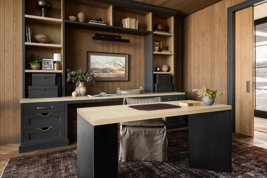 Wood-toned built-in cabinetry and desk in a completed interior